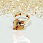 Gold ring with heart pendant