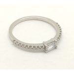 Unique baguette diamond engagement ring in white gold with a 0.3-carat brilliant-cut diamond