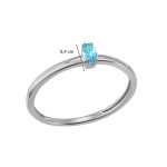 White gold ring with light blue topaz stone in a marquise setting