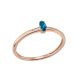 Rose gold ring with a marquise-cut blue topaz stone