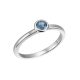 White gold ring with blue topaz in a button setting