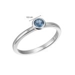 White gold ring with blue topaz in a button setting