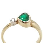 Gold ring with diamonds and emeralds