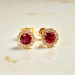 Gold flower earrings with red stones