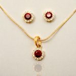 Gold flower earrings with red stones