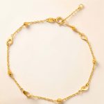 Thin gold bracelet with heart decorations
