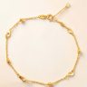 Thin gold bracelet with heart decorations