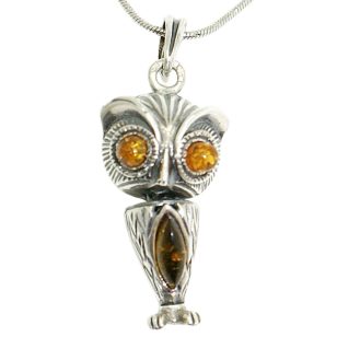 Antique silver pendant with amber owl