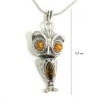 Antique silver pendant with amber owl