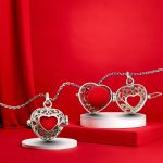 Openable silver heart belly bell pendant with red ball