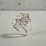 Silver cocktail ring with asymmetrical zirconia stones