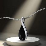 Silver twisted drop pendant with black onyx