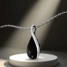Silver twisted drop pendant with black onyx