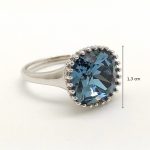 Silver cocktail ring with a spectacular blue stone