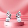Dangle pearl silver earrings with leaf decoration