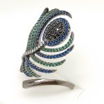 Silver cocktail ring with peacock feather blue, green, and black zirconia