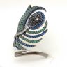   Silver cocktail ring with peacock feather blue, green, and black zirconia