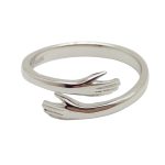 Silver adjustable ring with intertwined hands
