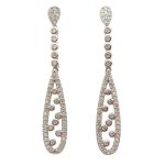 Silver jewelry set with drop earrings and pendant with zirconia stones