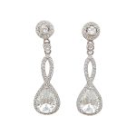 Silver drop jewelry set with earrings, necklace, and pendant featuring zirconia stones