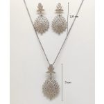 Silver jewelry set with pendant and earrings featuring a floral pattern and zirconia stones