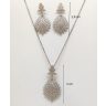   Silver jewelry set with pendant and earrings featuring a floral pattern and zirconia stones