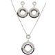 Silver jewelry set with pendant and earrings featuring black and white zirconia