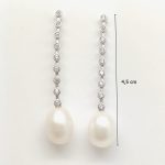 Silver casual earrings with pearl and zirconia embellishment