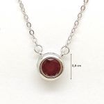 Silver necklace with ruby in a button setting