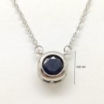 Silver necklace with sapphire stone in a button setting