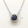 Silver necklace with sapphire stone in a button setting