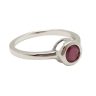 Silver ring with ruby stone in a button setting
