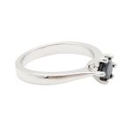 Silver engagement ring with round blue sapphire stone