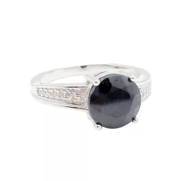   Silver ring with large blue sapphire stone and zirconia crystals