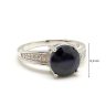   Silver ring with large blue sapphire stone and zirconia crystals