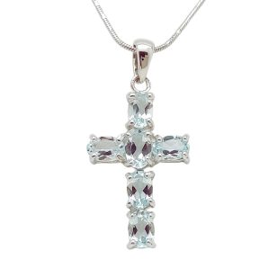 Silver cross pendant with genuine blue topaz