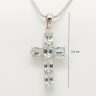 Silver cross pendant with genuine blue topaz