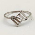 Silver ring with wave pattern
