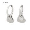 Small silver hoop earrings with dangling hearts