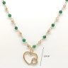 Silver necklace with green malachite beads and heart pendant