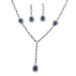 Silver necklace with blue stones and dark blue drop