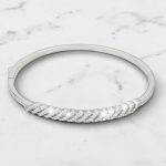 Silver bangle bracelet with diagonal pattern