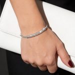 Silver bangle bracelet with diagonal pattern
