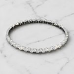 Silver bangle bracelet with stones all around