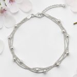 Three-row silver bracelet with beads