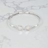 Silver open bangle with mother-of-pearl heart