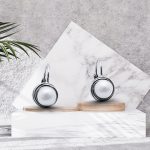 Silver pearl earrings with latch-back closure