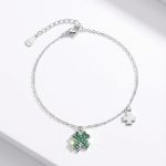 Silver bracelet with green stone clover charm
