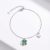 Silver bracelet with green stone clover charm