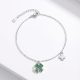 Silver bracelet with green stone clover charm